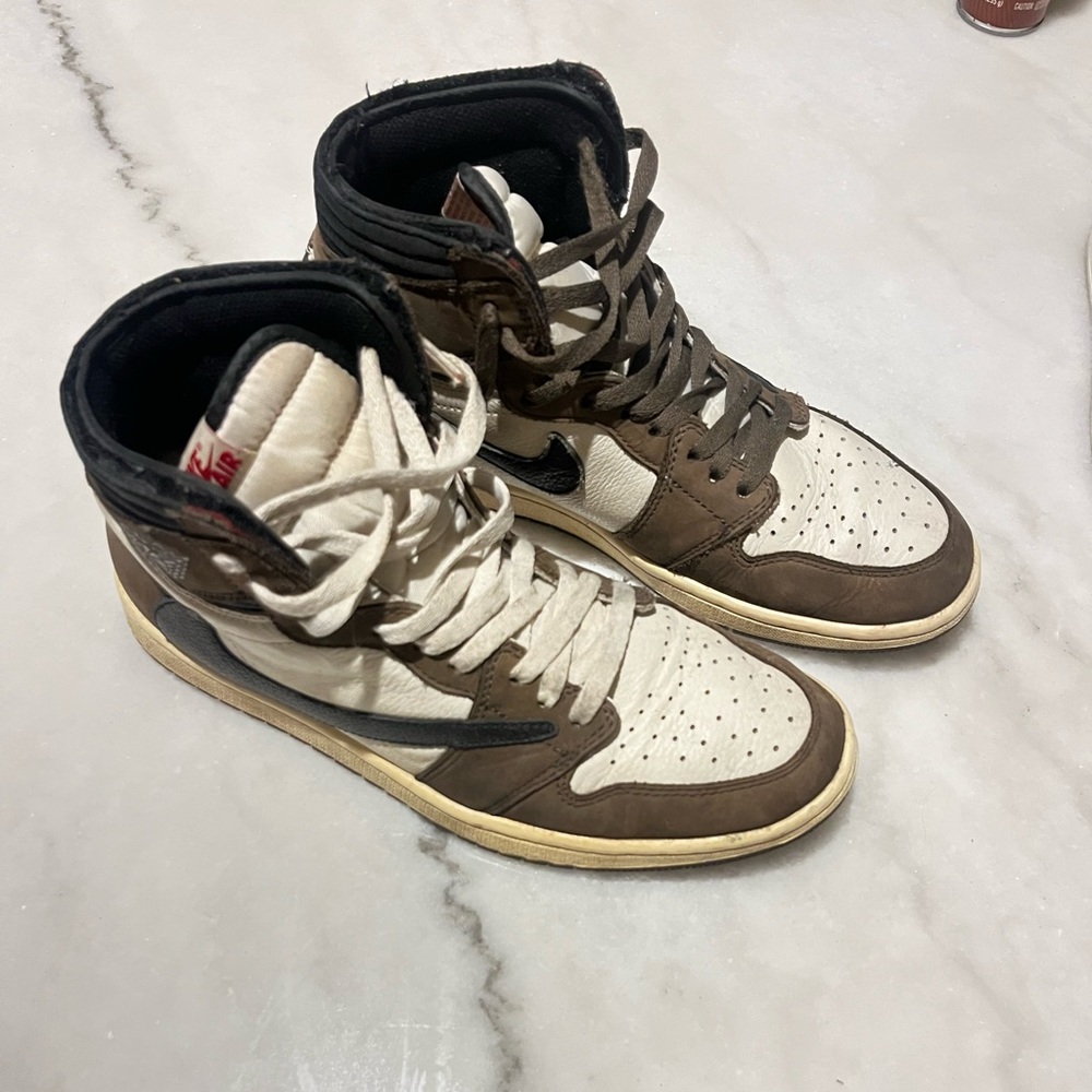 Travis Scott Aj’1 high tops.